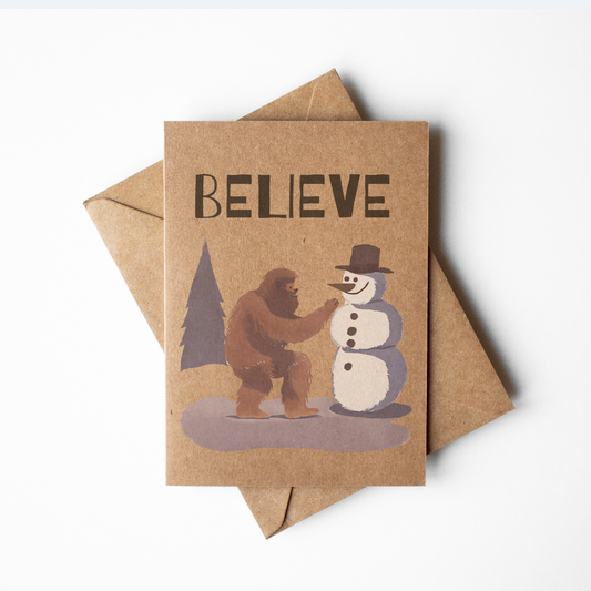 Brown Kraft Paper Rustic Bigfoot Building a Snowman Christmas Card